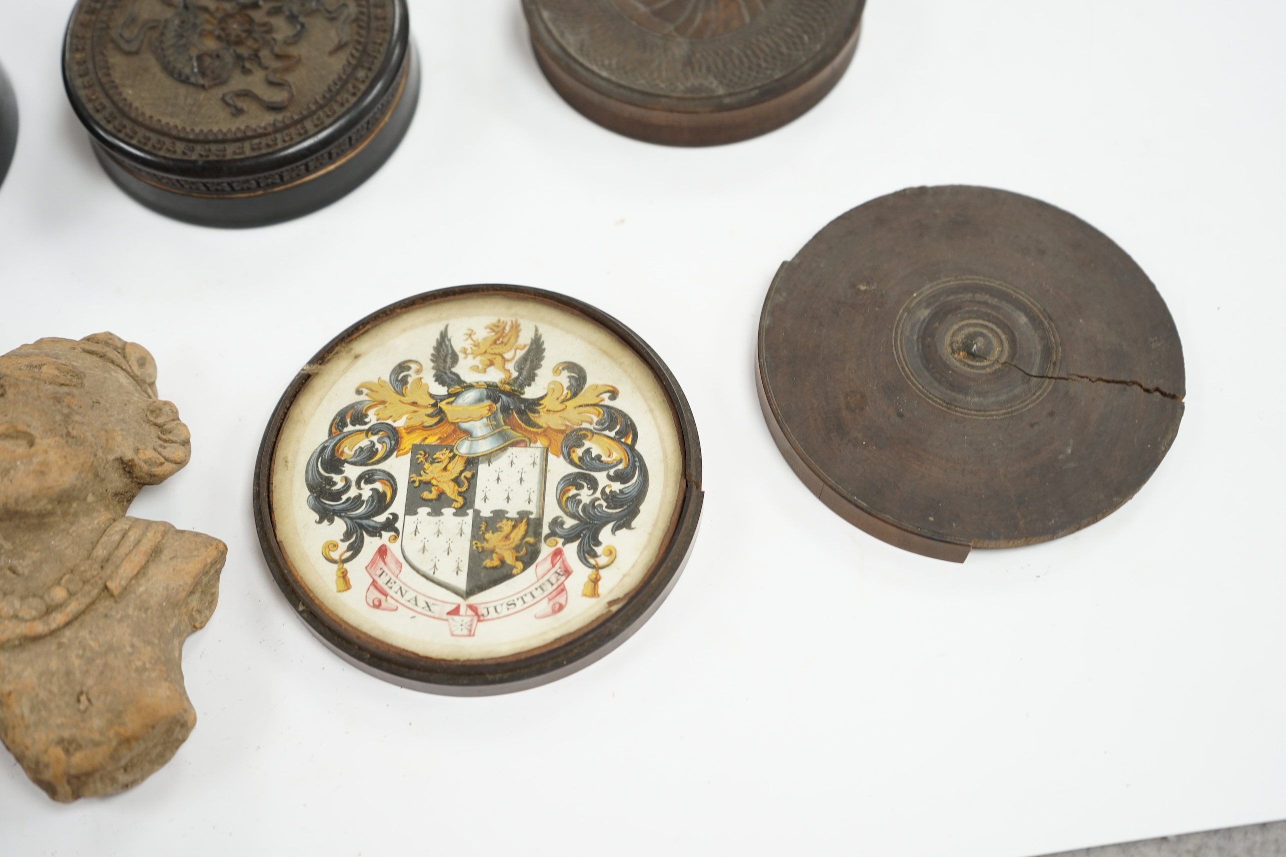 A carved wood case containing armorial crest, Tenax Justitiae, four other circular boxes and a portable compass etc, largest crest box 9.3cm diameter. Condition - mixed poor to fair